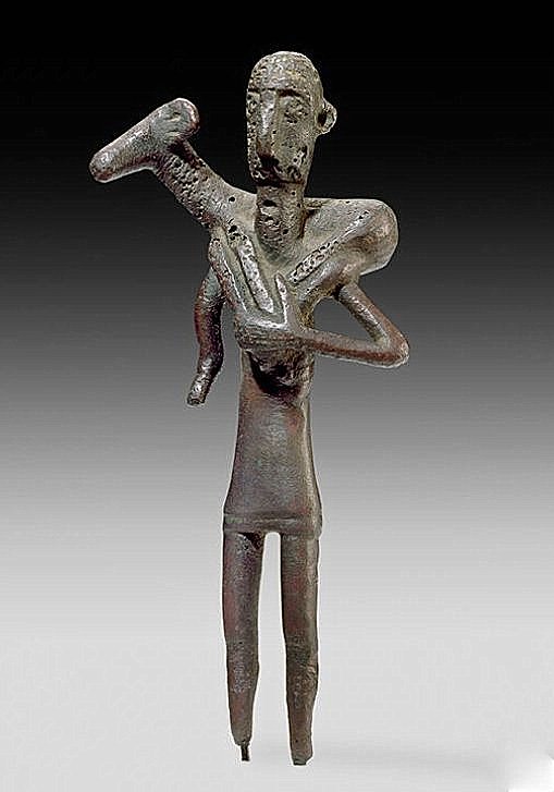 Bronze Sardinian statuette of a shepherd or worshipper carrying a ram, c. 800-700 BC. <a href="/MagicalEurope/">Wonders of Europe</a>