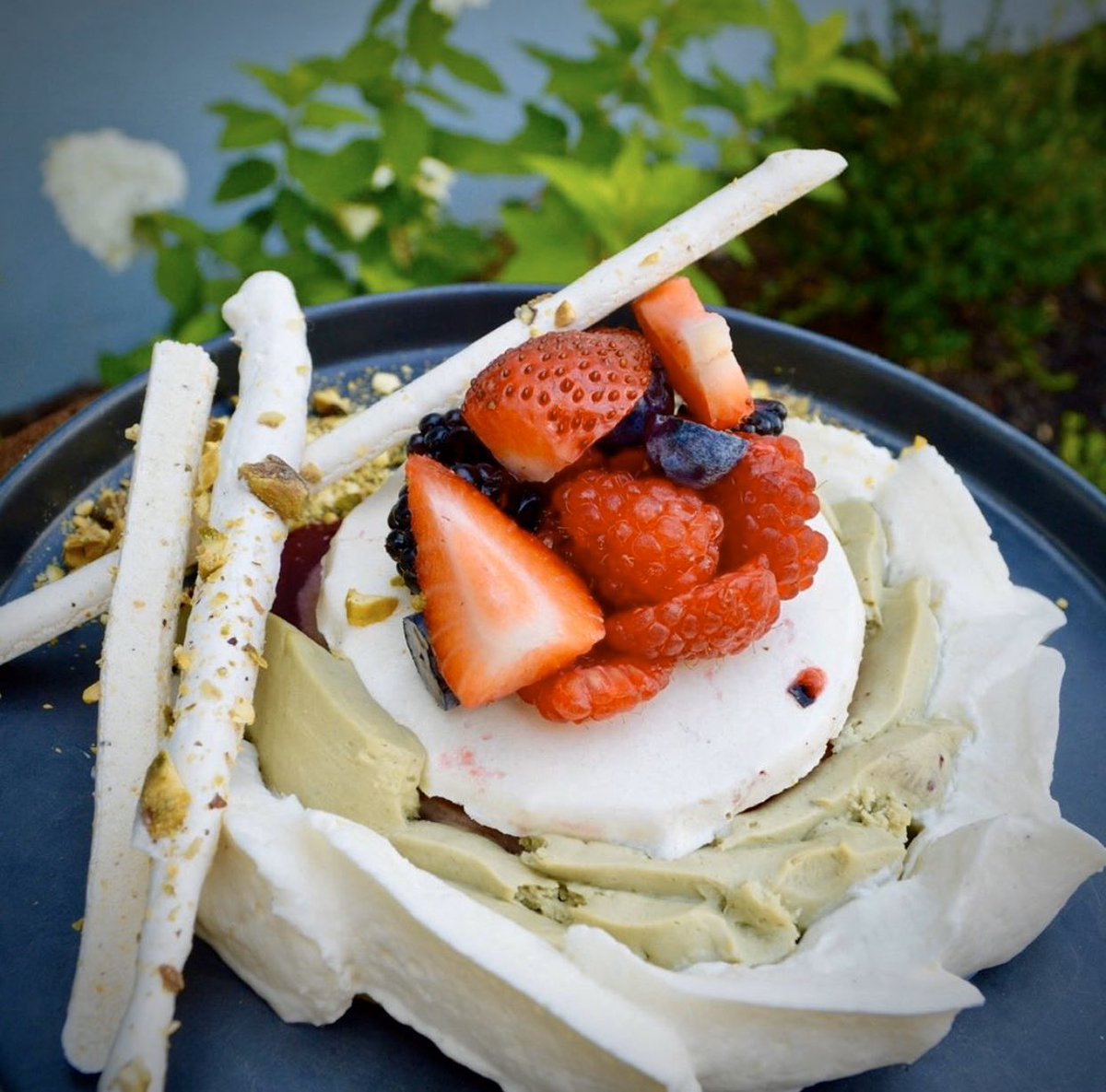 Sooo refreshing! Our Raspberry-Pistachio Vacherin -  pistachio ice cream, raspberry sorbet, pistachio chantilly, vanilla chantilly, meringue, raspberry sauce, and fresh berries. A Faubourg signature, by pastry chef Melissa Rodriguez.  ##faubourgmontclair #NJ #NY