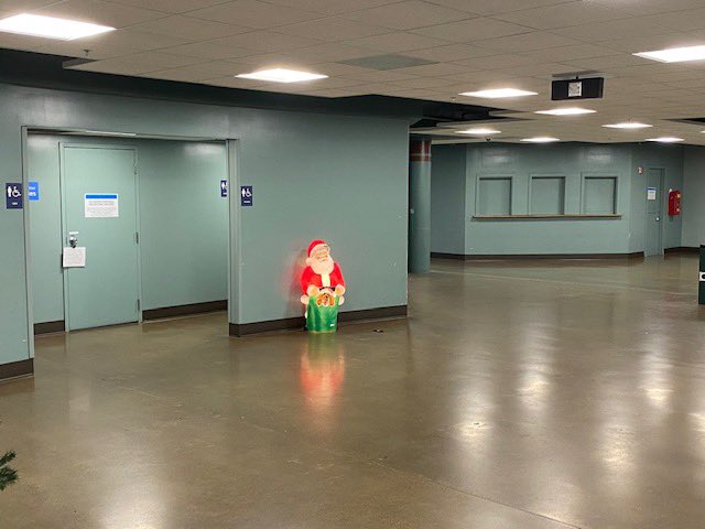 Waiting for the ferry to Seattle and this lone Santa by the restroom is making me sad.