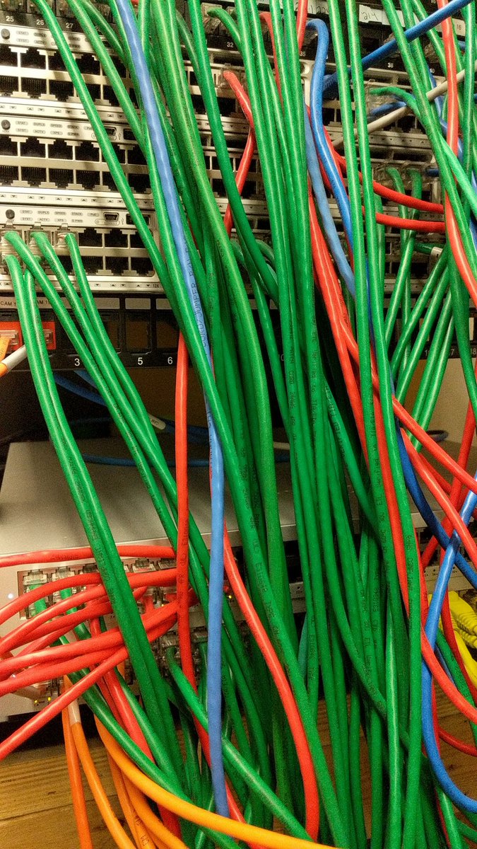 BeadlesPaul's tweet photo. Always nice to find Christmas colors in our network cables!  Thanks to Alex, Darren, and @natebarrett for upgrading the networks at Village and Maynard over Christmas break!  It's a bit messy now but will look a lot better when the project is completed. https://t.co/s5bsjPSN7M