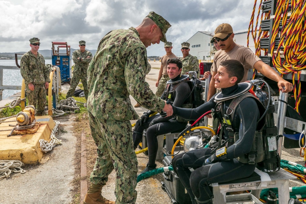 USPACOM's tweet photo. Sailors from Underwater Construction Team #UCT2 perform maintenance on Naval Base Guam wharf. @USPacificFleet #readiness #FreeandOpenPacific https://t.co/g75sqxFR0K