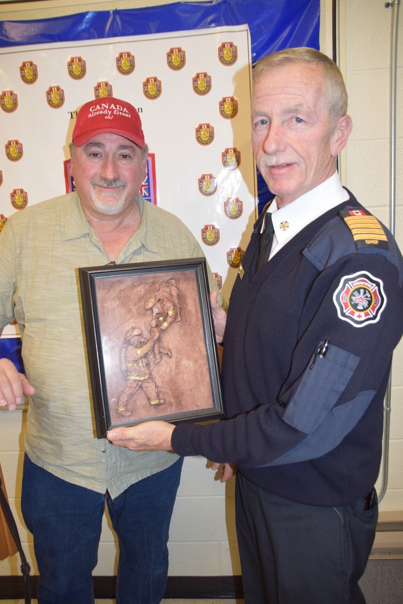 RESIDENT DONATES TO #AMHERSTBURG FIRE DEPARTMENT — A local resident donated some framed artwork to the <a href="/Aburg_Fire/">Amherstburg Fire</a> Department as a thank you to the service the fire department provides. Frank DiPasquale (left) made the donation to fire chief Bruce Montone.