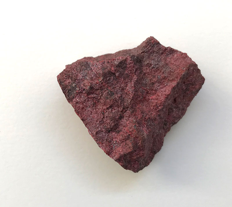 Vermilion is the synthetic form of a naturally occuring mercury sulphide: cinnabar زنجفر also called in Arabic "Chinese ochre" مغرة الصين due to its provenance. Vermilion is purer and much brighter than the pigment extracted from the natural rock, below. Either way, this compound
