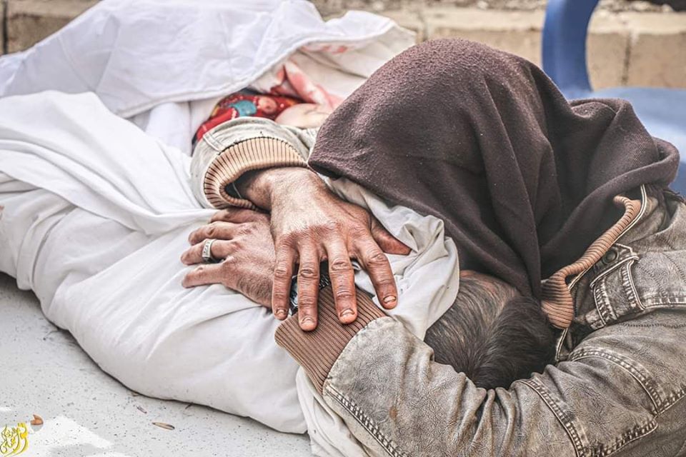 TheSyriaCmpgn's tweet photo. Even those who flee are not safe in #Idlib. Today warplanes targeted an IDP camp near the city of Saraqeb, killing 10 civilians including 5 children.

This picture is of a father weeping the loss of his little boy who was killed in the attack. 

#SaveIdlib 
#IdlibUnderFire https://t.co/iI2RQkG02k