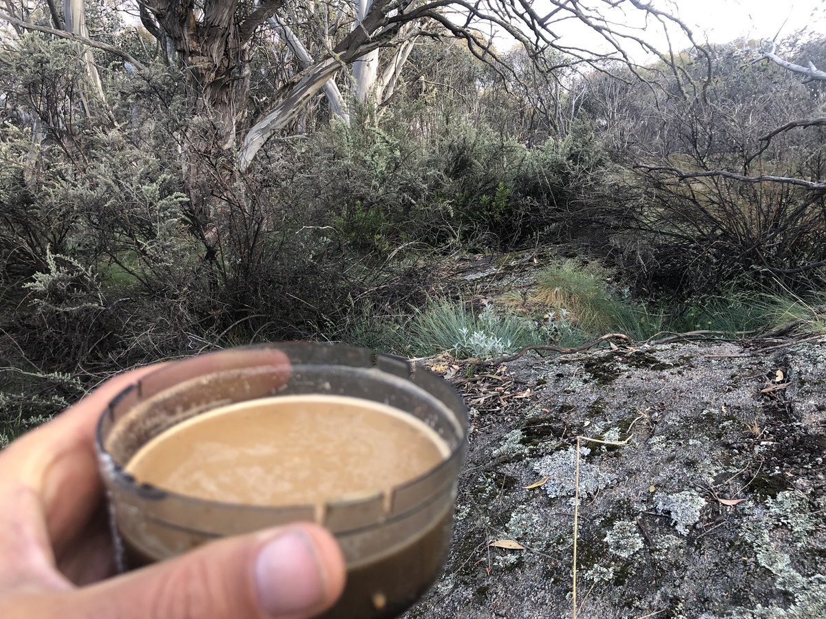 Christmas morning coffee on a rock under a mountain with snow patches on it. Merry Christmas all!