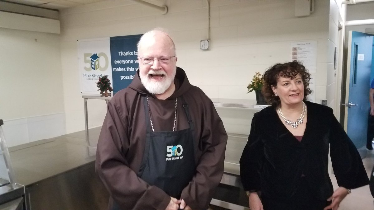 Suited up and ready to serve.   Cardinal O'Malley is helping out with Christmas Eve dinner at the Pine Street Inn.  He says the work of some 150 volunteerstoday gives him 'hope and faith in humanity.'