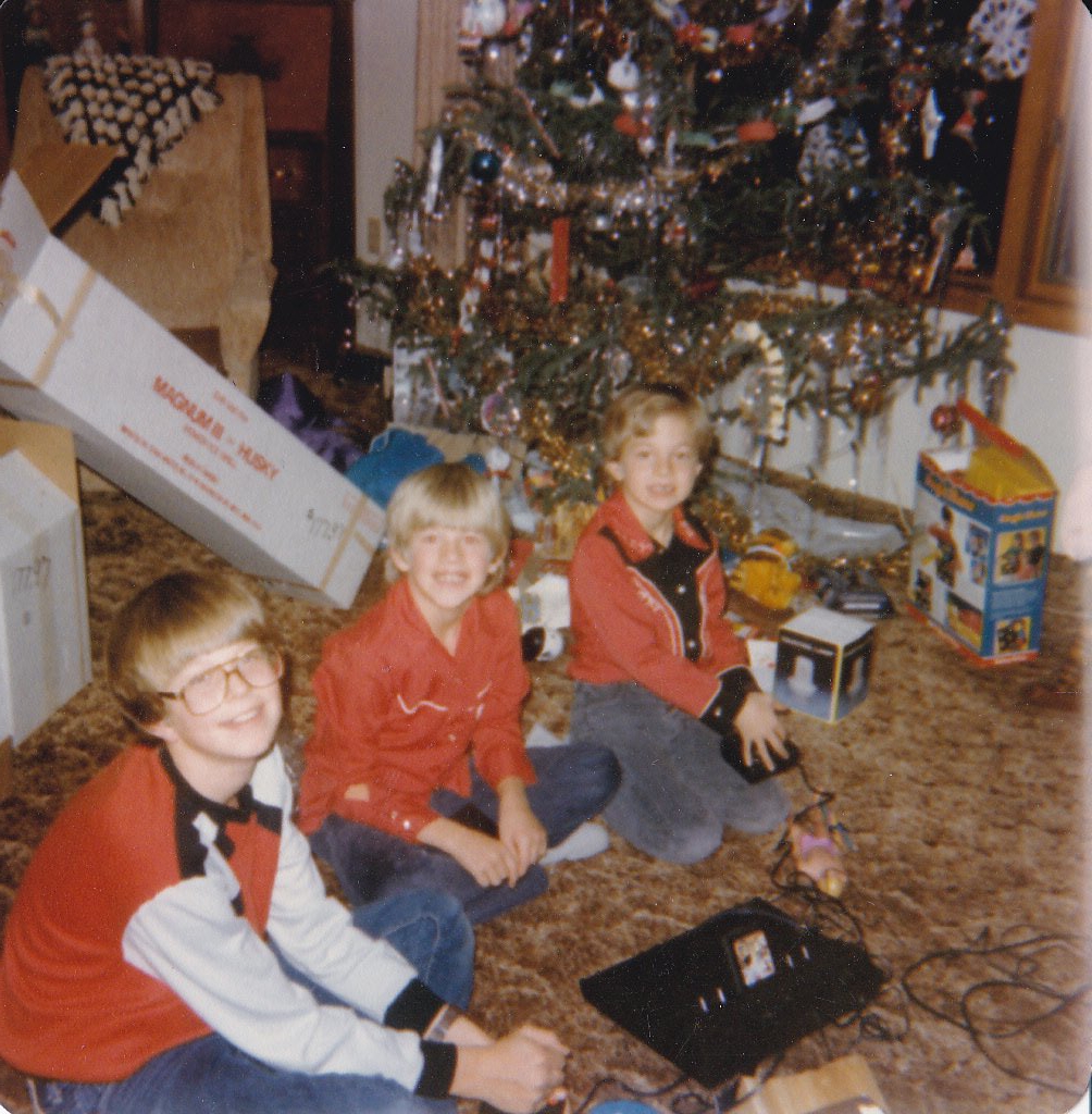 jeffskogstad's tweet photo. Christmas 1982: I'm not present, but here's nephews Jamie, Bob, &amp; Mike w/ their new Atari 2600. Second pic is bro-in-law Gary &amp; friend of the kids. I was fortunate to have received mine on Xmas '79, but as I can't find my pics I must document the joy of family. #TimeTravelTuesday https://t.co/rUkliwvjAU