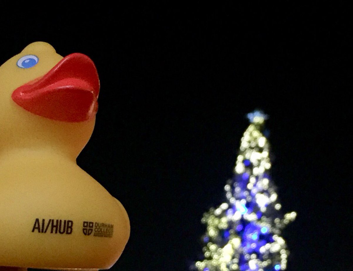 TheAIHub's tweet photo. Our #DebuggingDuck is doing last-minute shopping. We would like to wish you all a happy holiday season! #DCProud #TheAIHub @durhamcollege https://t.co/LQpi2KNVfC