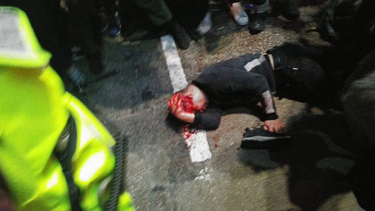 KongTsungGan's tweet photo. Merry Christmas from @hkpoliceforce part 2: Sing Tao reporter hit in head w pepper ball round (he was wearing full gas mask at time). 2 other reporters reportedly hit. A man left lying bloodied in the street. All after midnight in Mong Kok. https://t.co/kqQEO01jQS