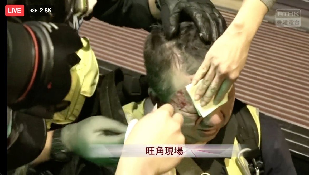KongTsungGan's tweet photo. Merry Christmas from @hkpoliceforce part 2: Sing Tao reporter hit in head w pepper ball round (he was wearing full gas mask at time). 2 other reporters reportedly hit. A man left lying bloodied in the street. All after midnight in Mong Kok. https://t.co/kqQEO01jQS