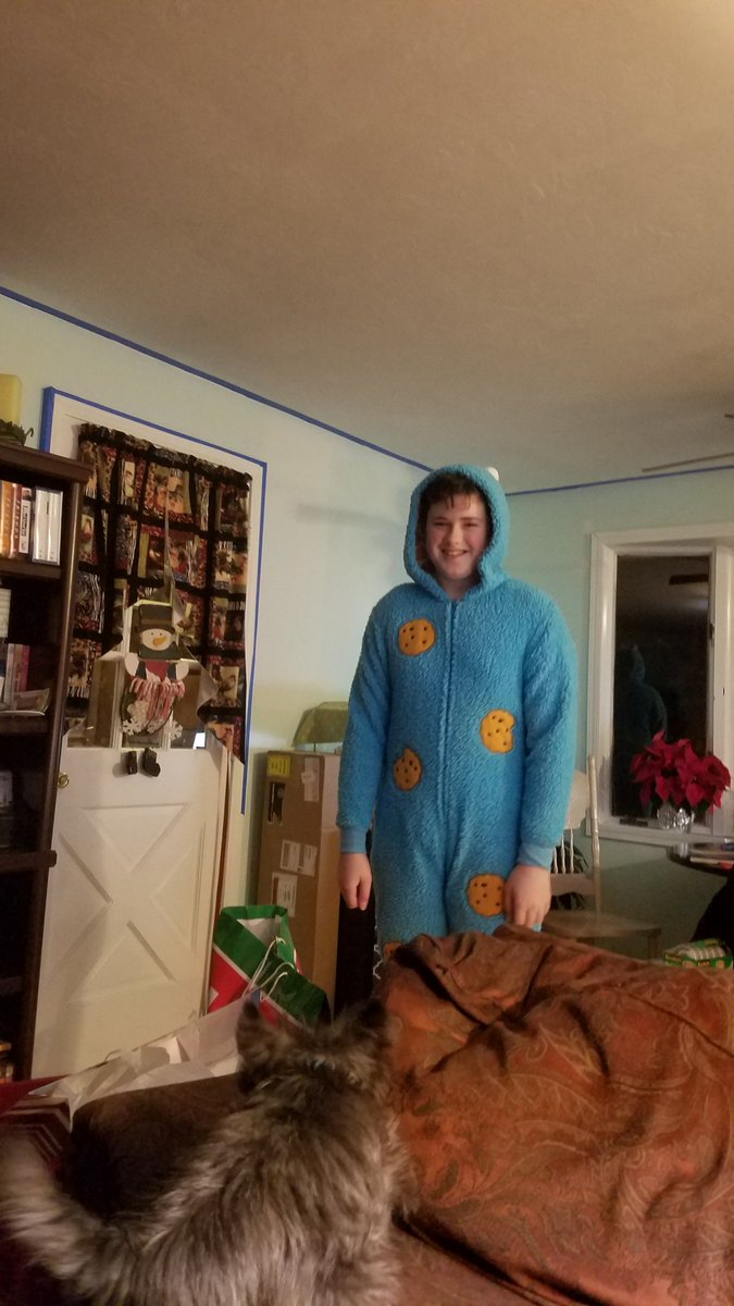 Christmas tradition the holiday onesy worn to bed and Christmas morning. I am glad he still plays along.