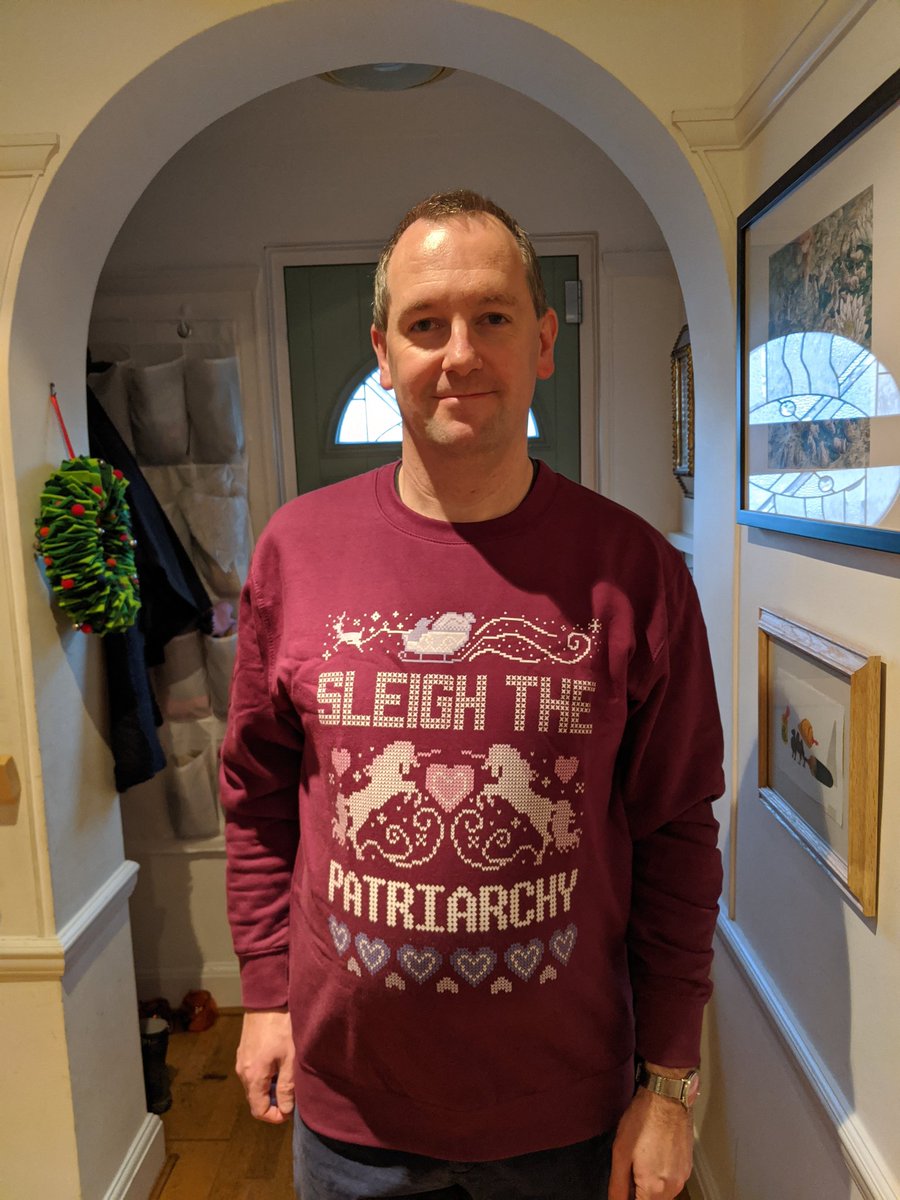 Jon in a jumper with "sleigh the patriarchy" on it