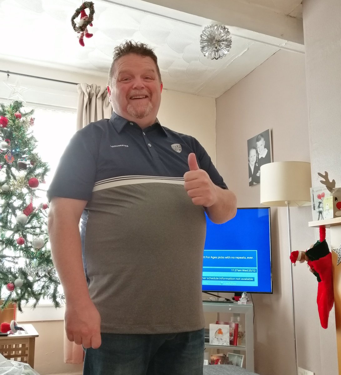 @GolfVlogsUK Very Merry Xmas GolfMates from me and my own GolfMate @caddyshack71 I think he likes his new golf shirt!!! #topwife #golfmates #lifeislife