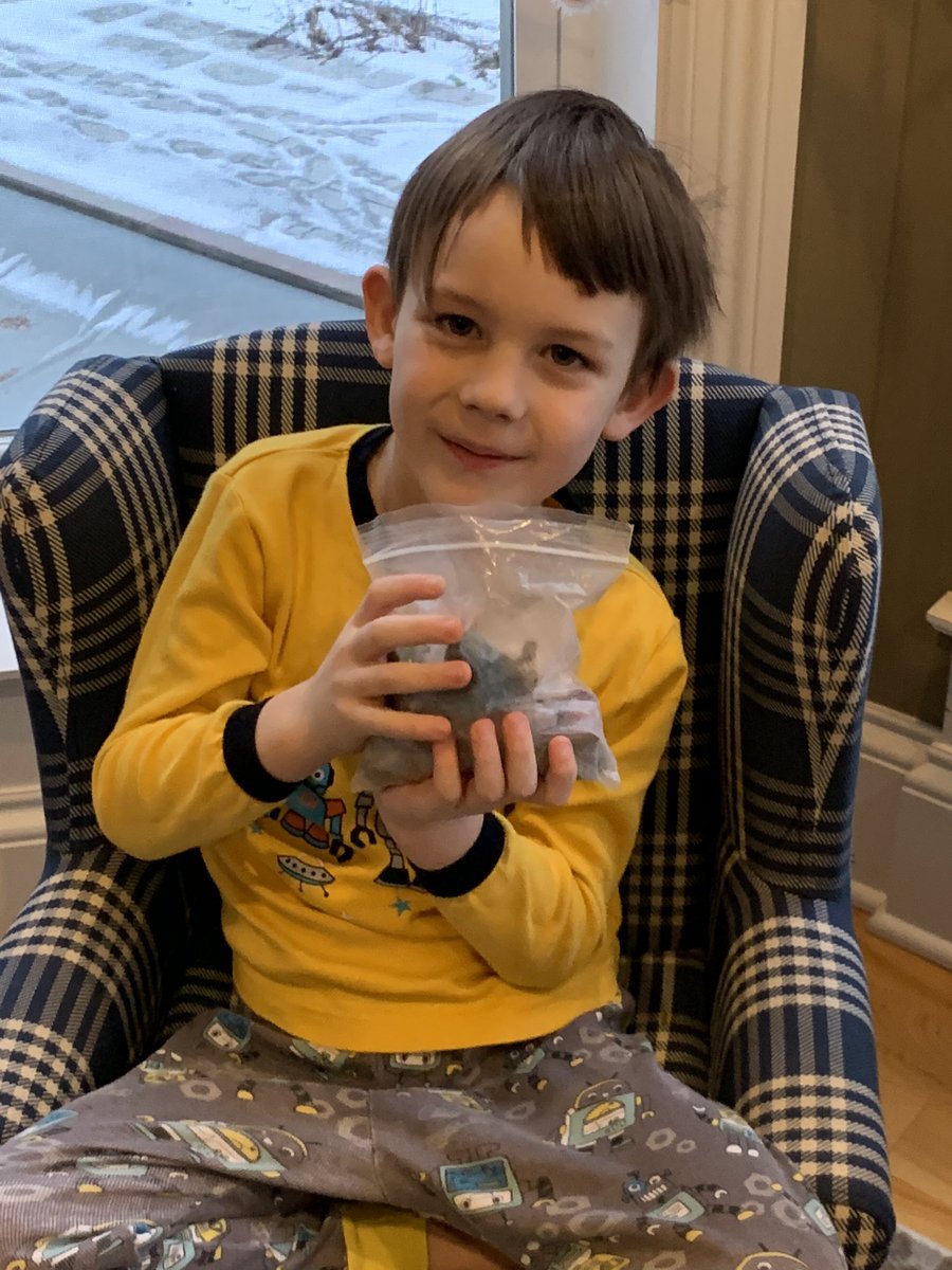 My kid, possibly one of the few who is elated that Santa left him rocks in his stocking. Merry Christmas