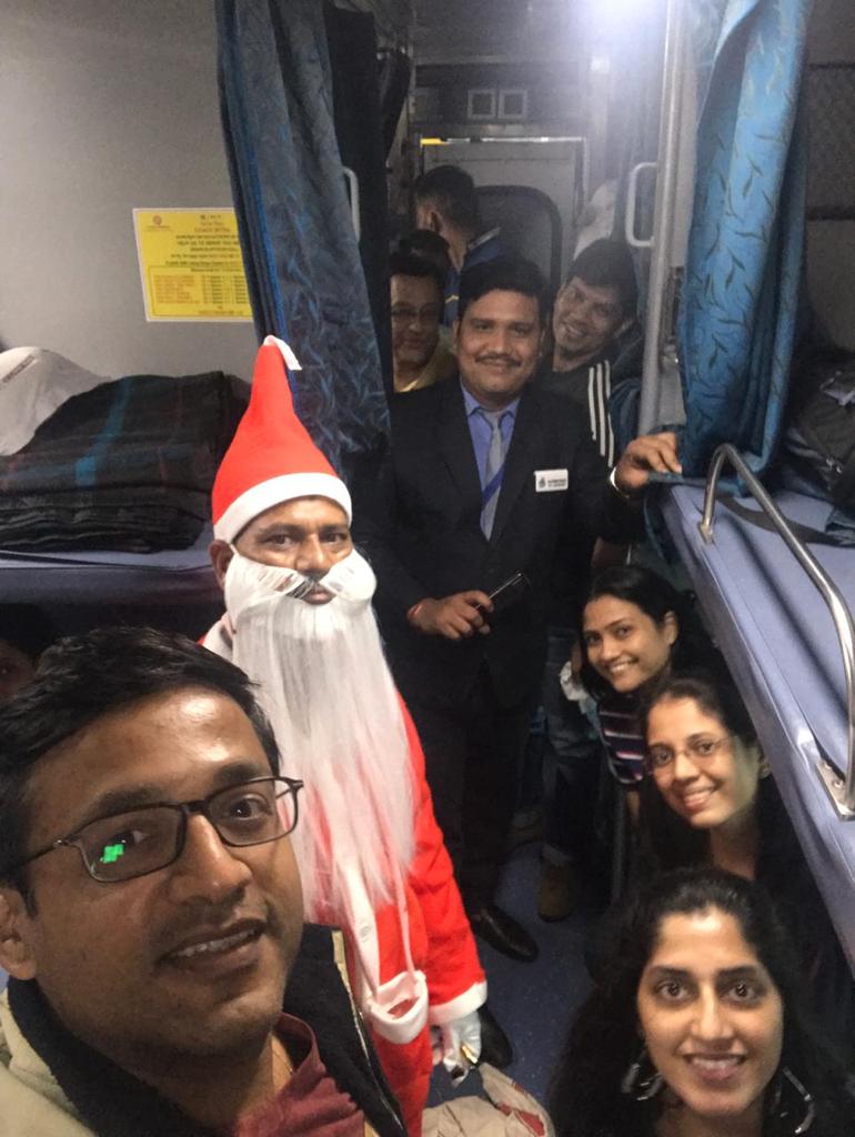 andya_k's tweet photo. Who would expect a visit by Santa in Indian train journey. Thanks @indianrail @PMOIndia for making railway journey cleaner and more enjoyable. https://t.co/pMOm01IQGv