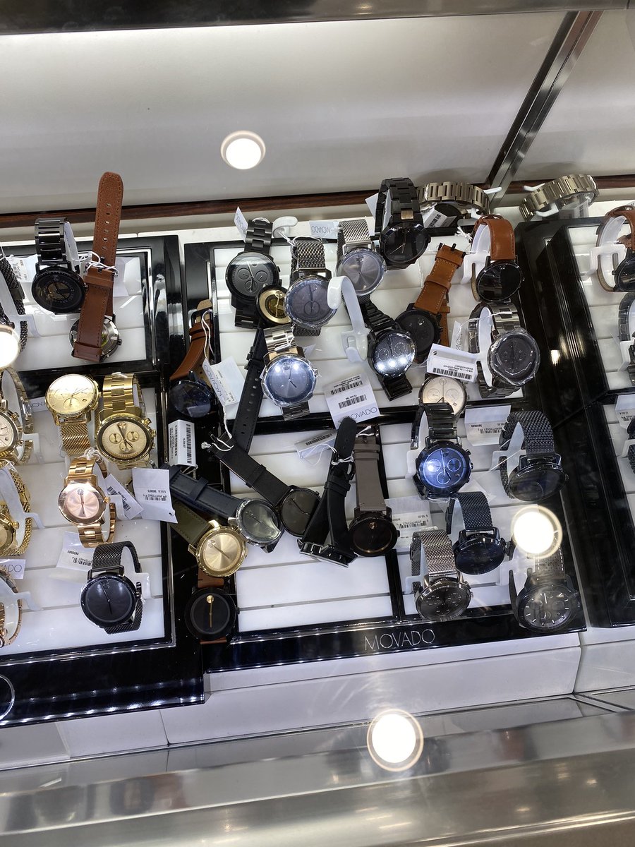SusDuke4's tweet photo. @Movado this is how you want your watches set up during Christmas time shopping let alone ever? Such a mess and all scraping each other. I blame @Macys, was going to buy one for a family member but had to turn away. https://t.co/cfXURAkGXK