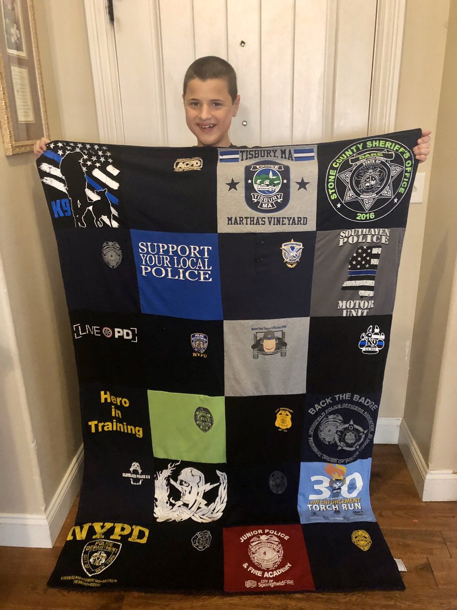 FlatCaleb's tweet photo. Calebs favorite gift. Police shirt blanket for when he is scared and wants his police friends around him. He wants another one. 😬👮🏻‍♂️🚓🚔 https://t.co/AhbIoXpNp2