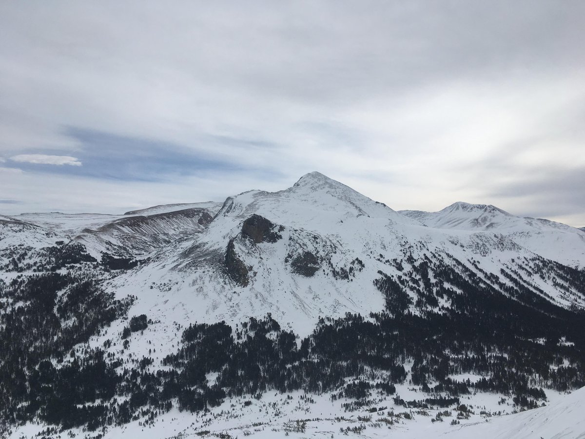 Snowy mountain with canyon below