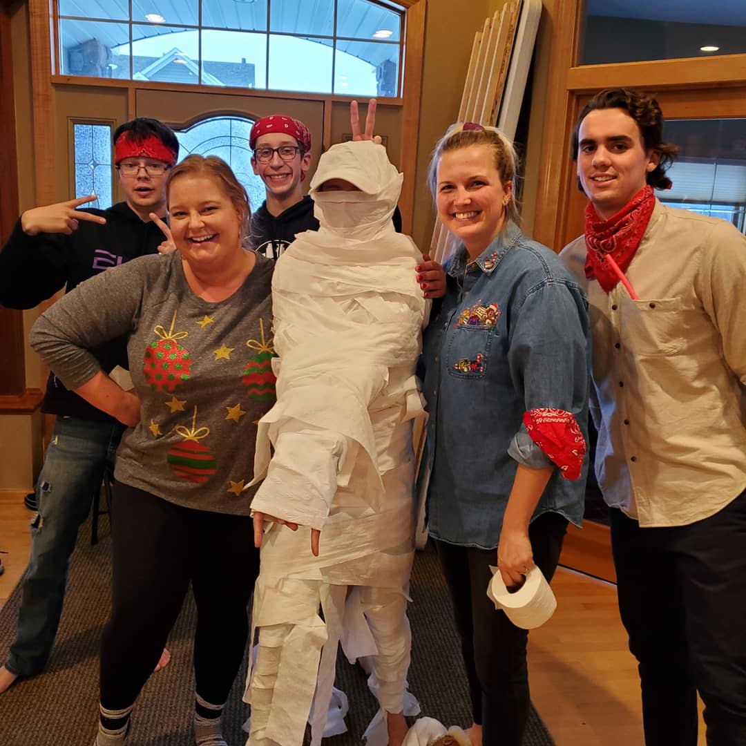 mommymcgraw's tweet photo. All 7 kids home for Christmas. The annual tradition of "friendly" Christmas competition continues. Doesn't everybody do a toilet paper mummy battle? Merry Christmas from our slightly crazy family to yours! #wearenuts @cc_mcgraw #B1Gmummy https://t.co/WrpKqBsHEi