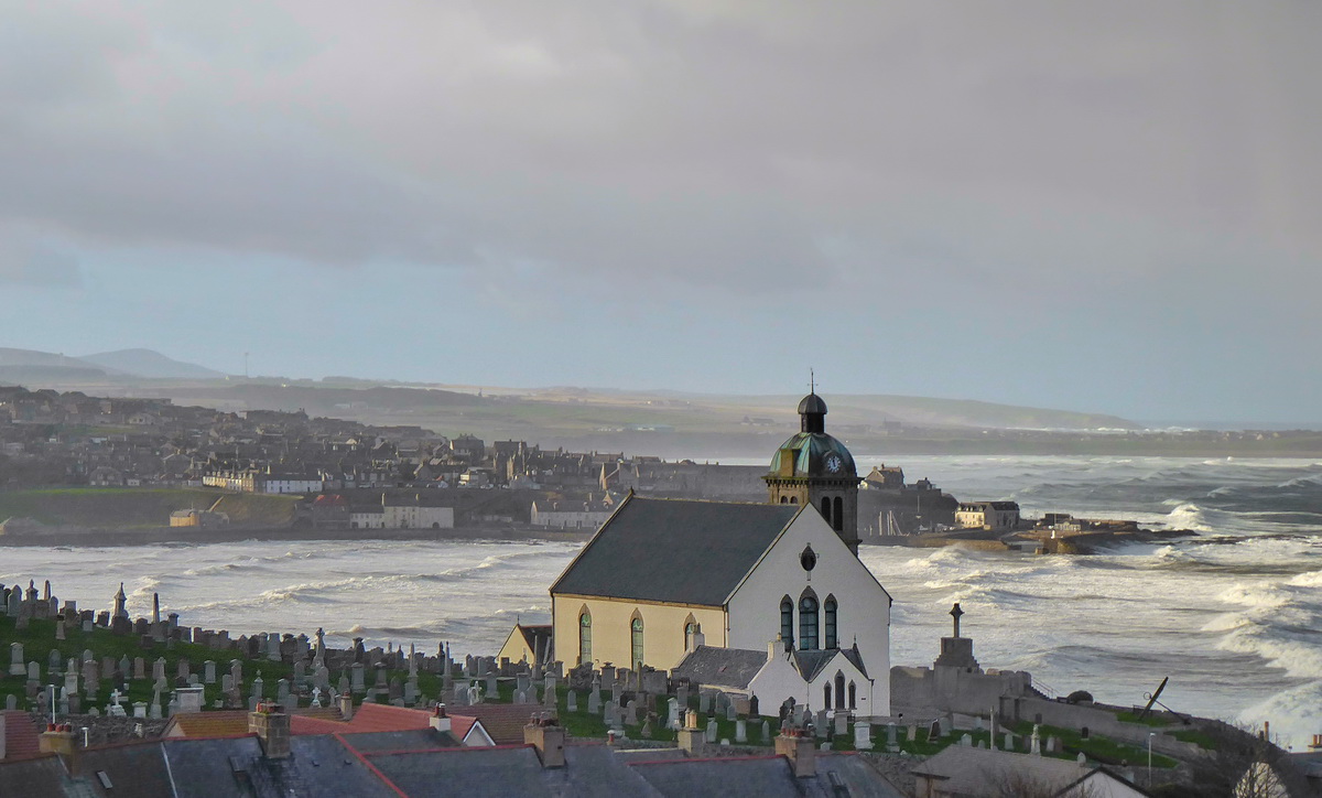 Waves on the Deveron, with Macduff Parish Church in the foreground.