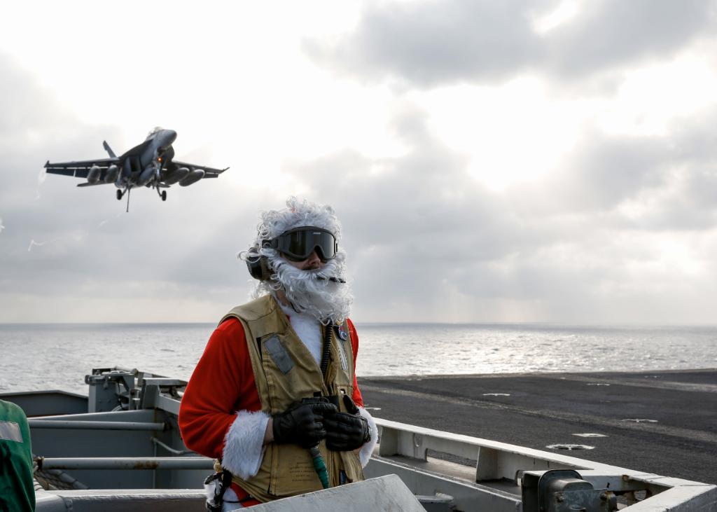 #Santa's helpers hard at work! Sailors spread holiday cheer on the flight deck of #USSAbrahamLincoln while on deployment.