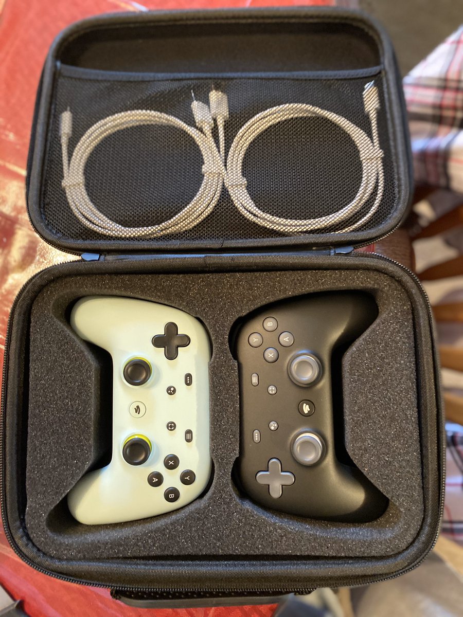 flowmastr1x's tweet photo. My two boys have joined me on @GoogleStadia now. There controllers are on the left, mine is on the right. Everything is protected in a case https://t.co/nxPc9EfM3F