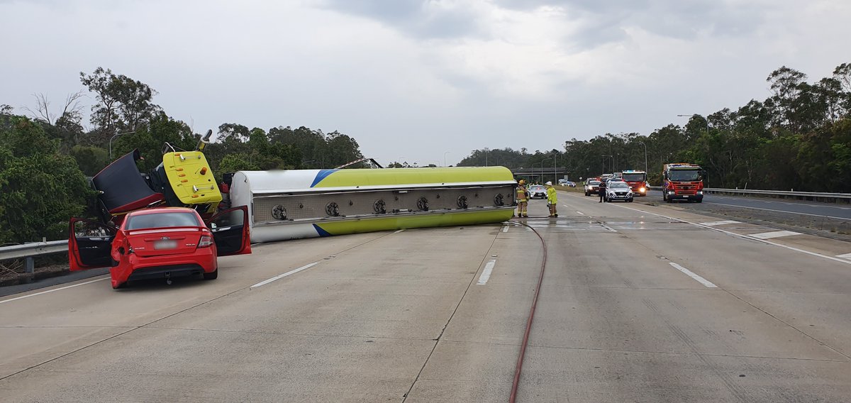 QldPolice's tweet photo. Police declare emergency situation on M1 at Helensvale after fuel tanker crash. M1 blocked in both directions, please avoid the area. https://t.co/PR0Q8E3M7B https://t.co/rSe8diA2KS