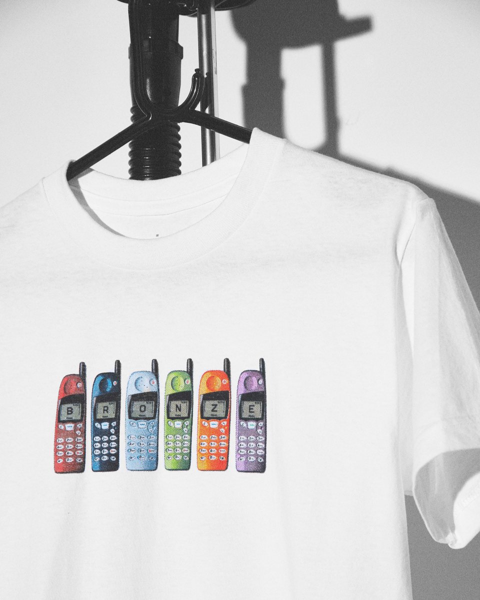 endclothing's tweet image. Bronze 56k dials back to retro handsets with this white tee -- end.global/9yj