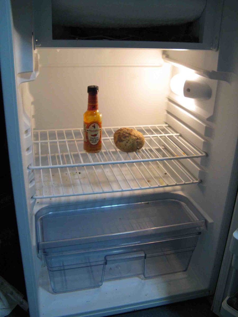 cbartsimpson's tweet photo. kim kardashian's fridge is basically an entire house, and my fridge be looking like this https://t.co/7SVHnfSoSj