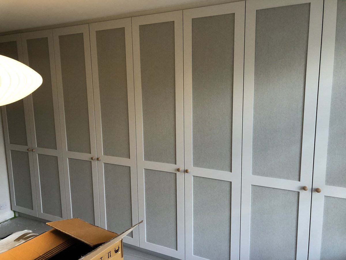 A lovely example of painted wardrobes with a wall paper inlaid panel....#wardrobes #bespokewardrobes #builtinwardrobes
