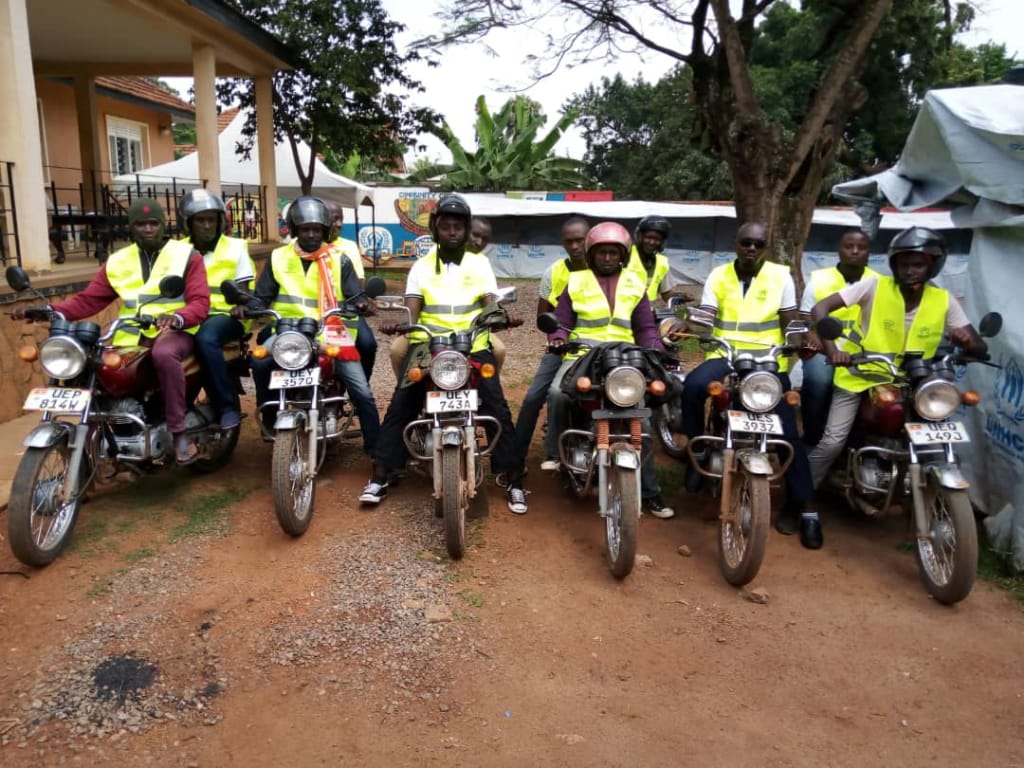 InterAidUganda's tweet photo. The SGBV campaign continues through the different activities. @InterAidUganda SGBV team gives away reflector jackets to the boda boda riders at Guterres community center in the campaign against Sexual Gender Based  Violence. https://t.co/XSQzOzmZuw