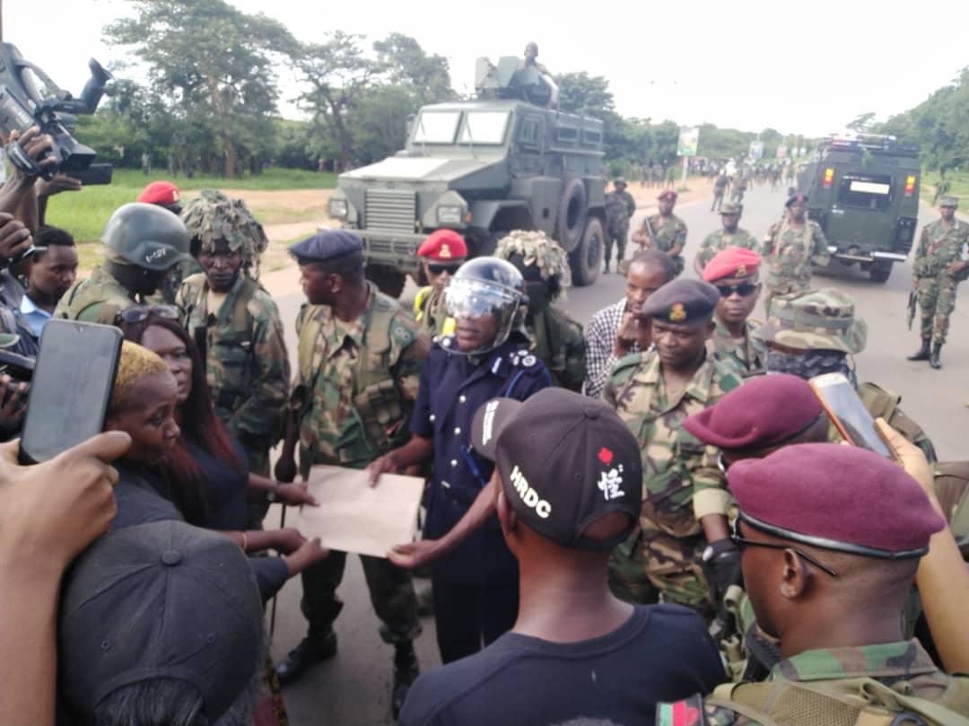 Picture of the day as deputy police IG (in helmet) receives HRDC petitition