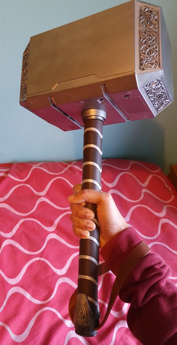 Me holding Marvel Thor's Hammer from the MCU movies.