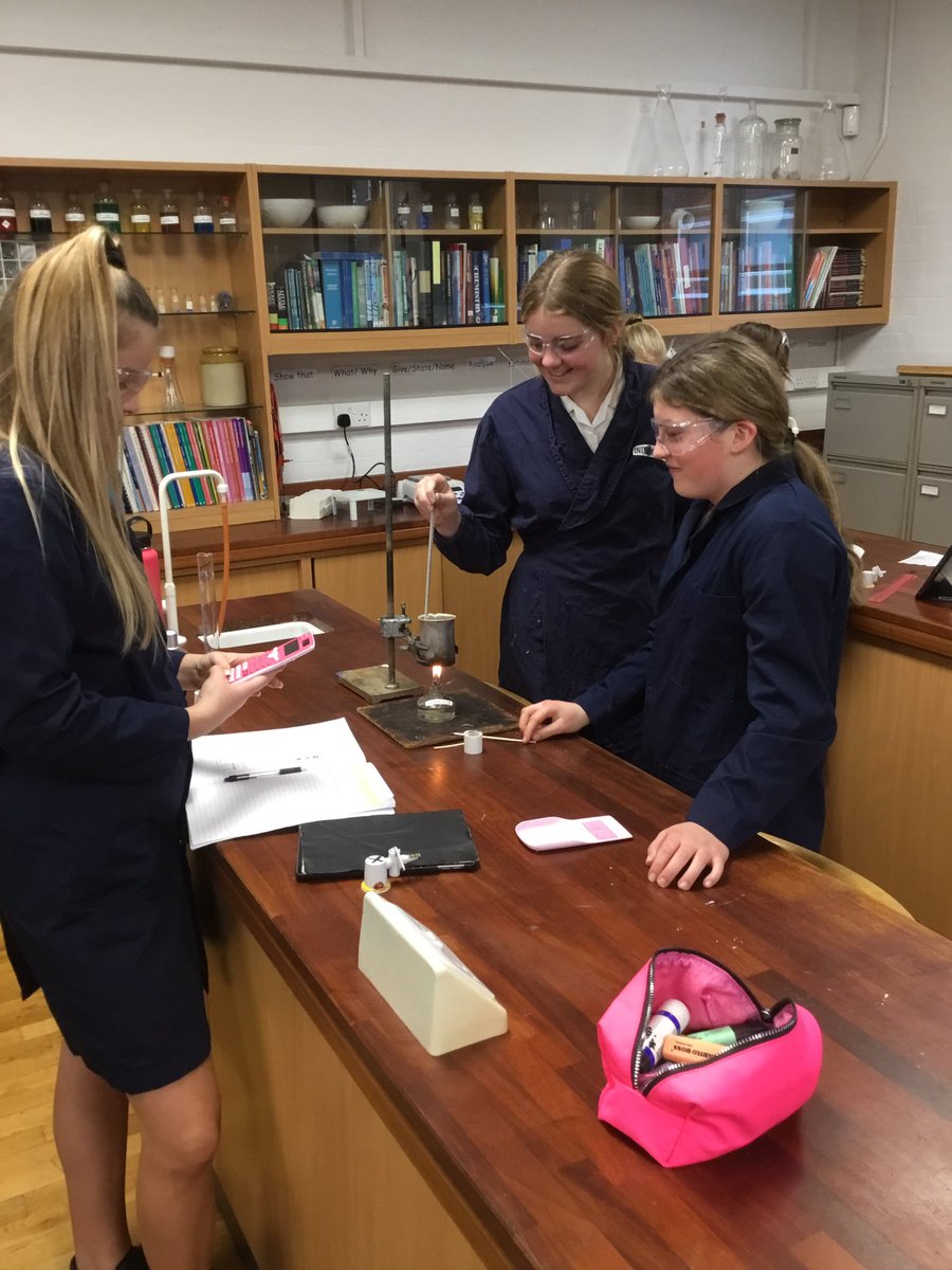 BGS_Chemistry's tweet photo. Year 10 girls are measuring the enthalpy change of burning fuels using calorimetery. They have been finding connections between @BGSBiologyDept and Chemistry as they realised they have used this method in Year 9 when burning crisps! #HPL #calorimetry #connectionfinding https://t.co/fMi1PdKgfV