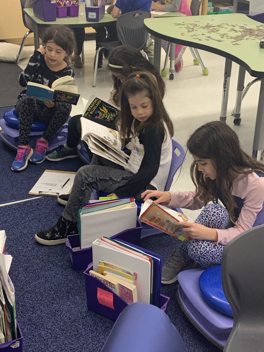 Second graders enjoying reading with partners and hearing a good story with Miss DiJohn! #kip109, #engage109