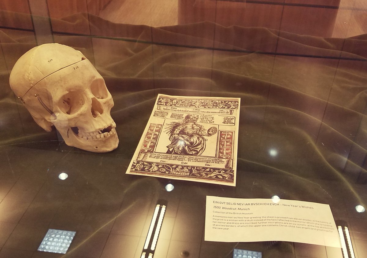 EHSLibrary's tweet photo. Come to the main level and check out this harrowing but oddly charming New Year's memento mori and the rest of the exhibit curated by our own wonderful @DBaluchi 💀🖤 #medfactmonday https://t.co/9goAPxaN5S