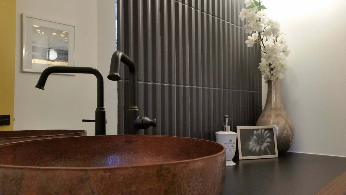 Check out this amazing black tile we used in our powder room in one of our #knottypines in #northglenora! The texture really ties the interior to the exterior of this amazing home!