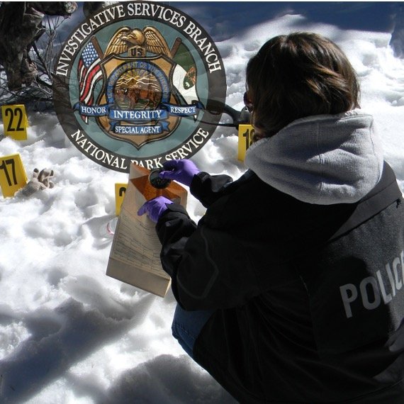 NPS image of an ISB Special Agent collecting items of evidence on snow-covered ground.