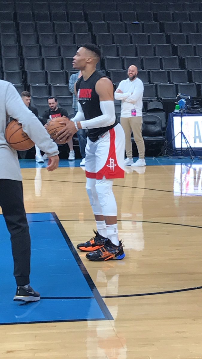 Russell Westbrook wearing Thunder colored shoes for his warmups in OKC.