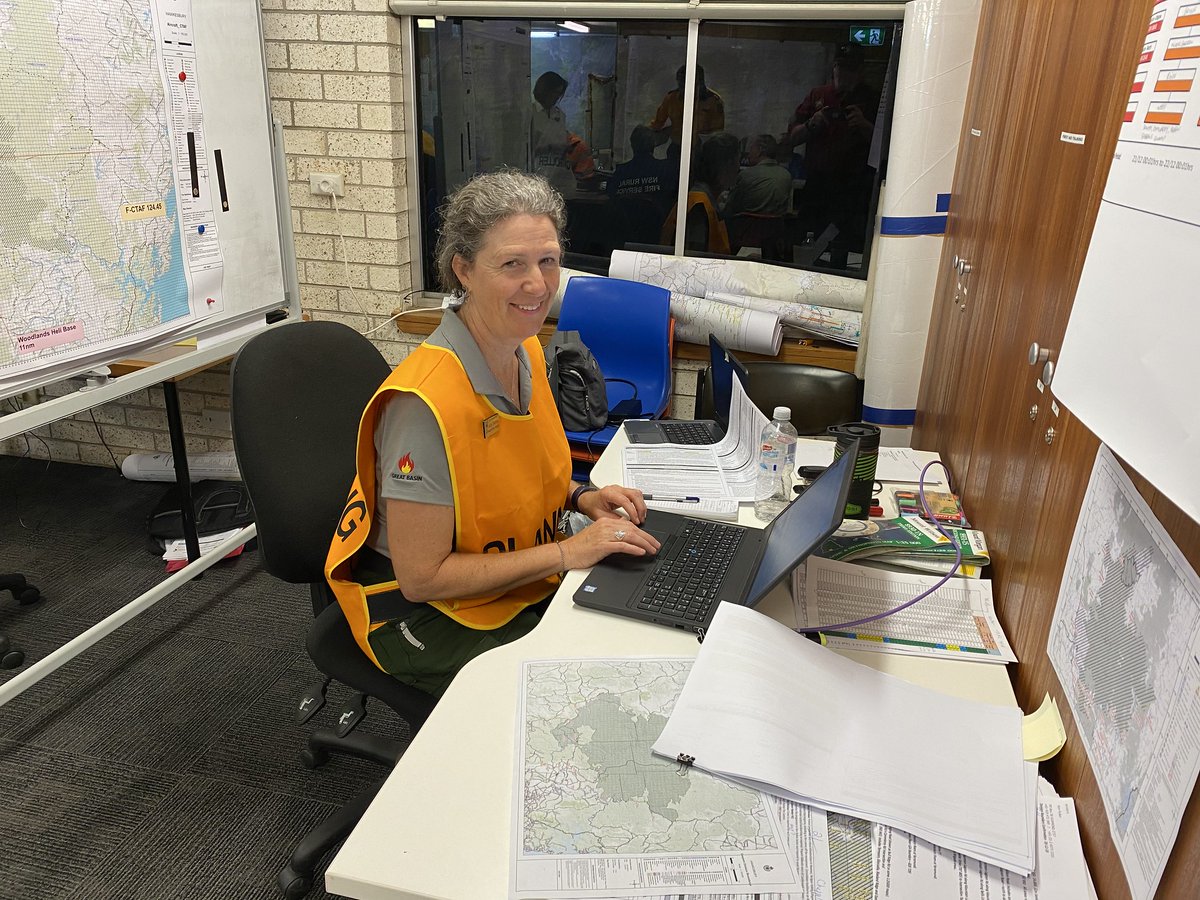A person typing on a laptop computer