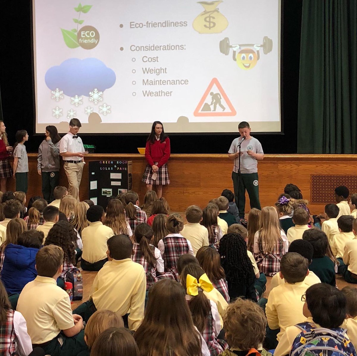 MsgrSladeSchool's tweet photo. A #msgrslade #firstlegoleague robotics team presents their project to fellow students this morning. They also prepared an exciting quiz game for some members of the audience. Great work, City Flyers! #msgrslademoment https://t.co/ndmyDS6Sfd
