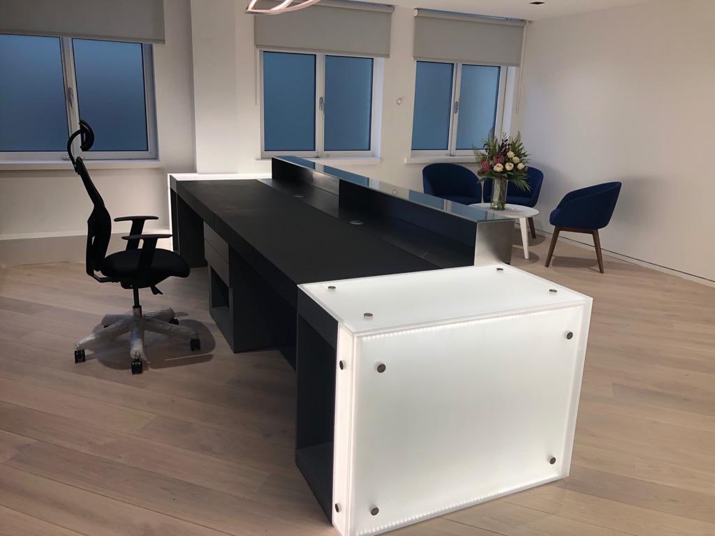 Lignify1's tweet image. Recent installation of light sheet reception desk with sand blasted glass and an additional stained birch plywood feature wall with blue acrylic light box