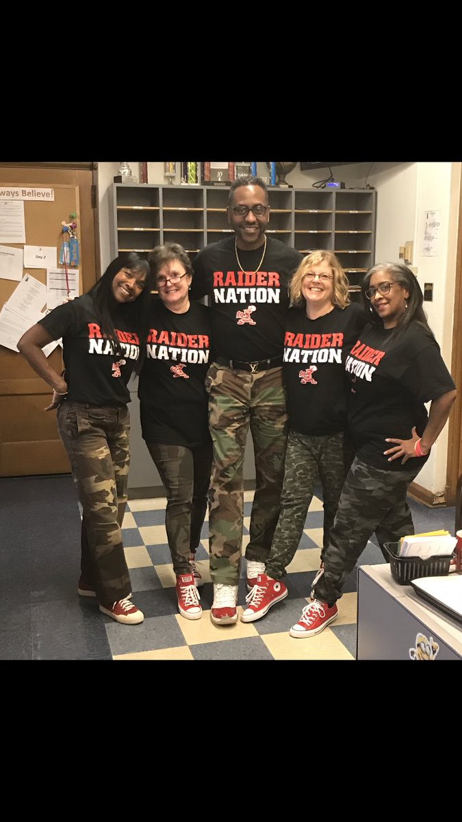 My office team at Woodbury decided to dress in camouflage, Raider Nation Tees &amp; red shoes on break down Fridays! #Family