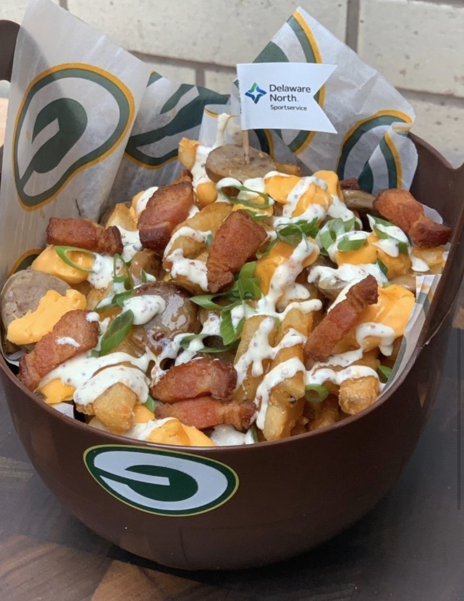 New at the <a href="/packers/">Green Bay Packers</a> playoff game this weekend: Playoff Poutine –  French fries, Johnsonville “brat coins,” fresh cheese curds, Cudahy slab bacon, chicken gravy, beer mustard crema &amp; scallions in an old style football helmet.