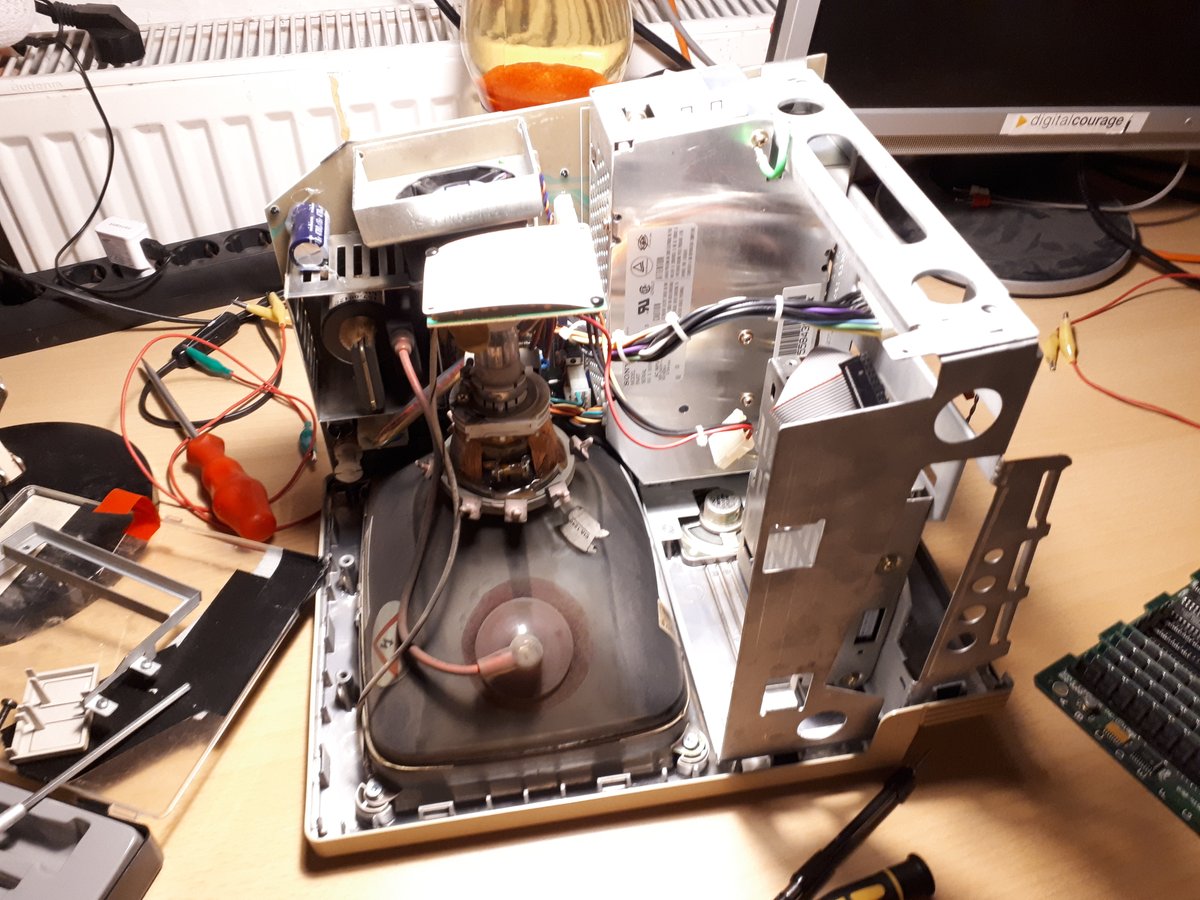 Inner view of SE/30 housing with display tube in front, removed hard drive and logic board.