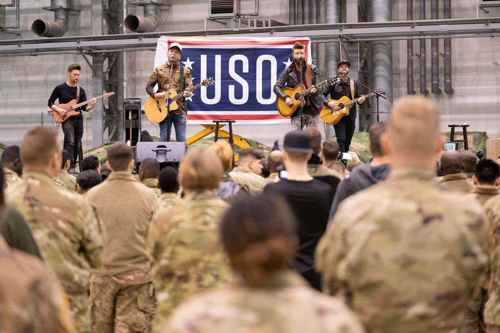 The_USO's tweet photo. With a show from Sr. Enlisted Advisor to the Chairman of @thejointstaff Ramon Colon-Lopez, MMA fighter @ilimanator, country band @LOCASHmusic and others, the USO New Year's tour saluted our troops in Poland. #USOTour2020 📸: @deptofdefense photos by @USArmy Sgt. James K. McCann https://t.co/cRlj7vcOni