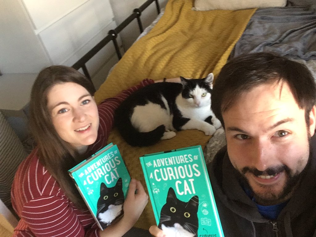 I found my love the perfect gift A Zelda book her heart to lift Her gift to me To my surprise, Familiar shape Familiar size... We share a grin As we unwrap... TWO Curious Cats?! For us it’s... SNAP! Thanks @CuriousZelda! (With Penguin, @sopranoclaire and our curious cutie)