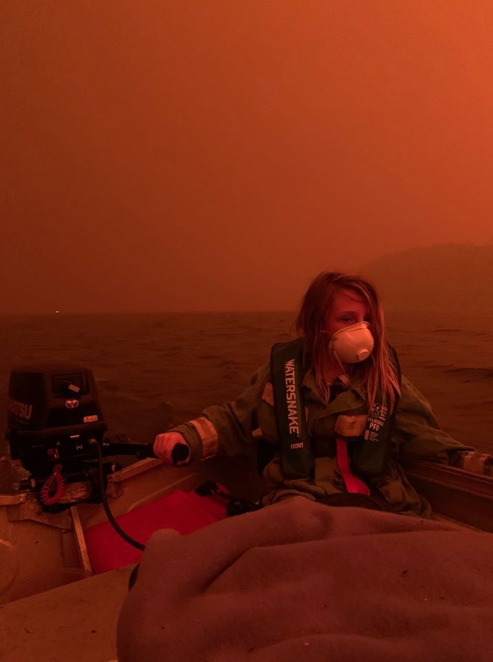 'A mother took this photo. Her two primary school aged sons are in the boat with her. They're out on the #Mallacoota lake trying to stay safe from fire, it doesn't look like it - but it's daytime.' ~ABC Gippsland. #bushfirecrisis #vicfires #NSWfires #Bushfires #bushfiresVIC