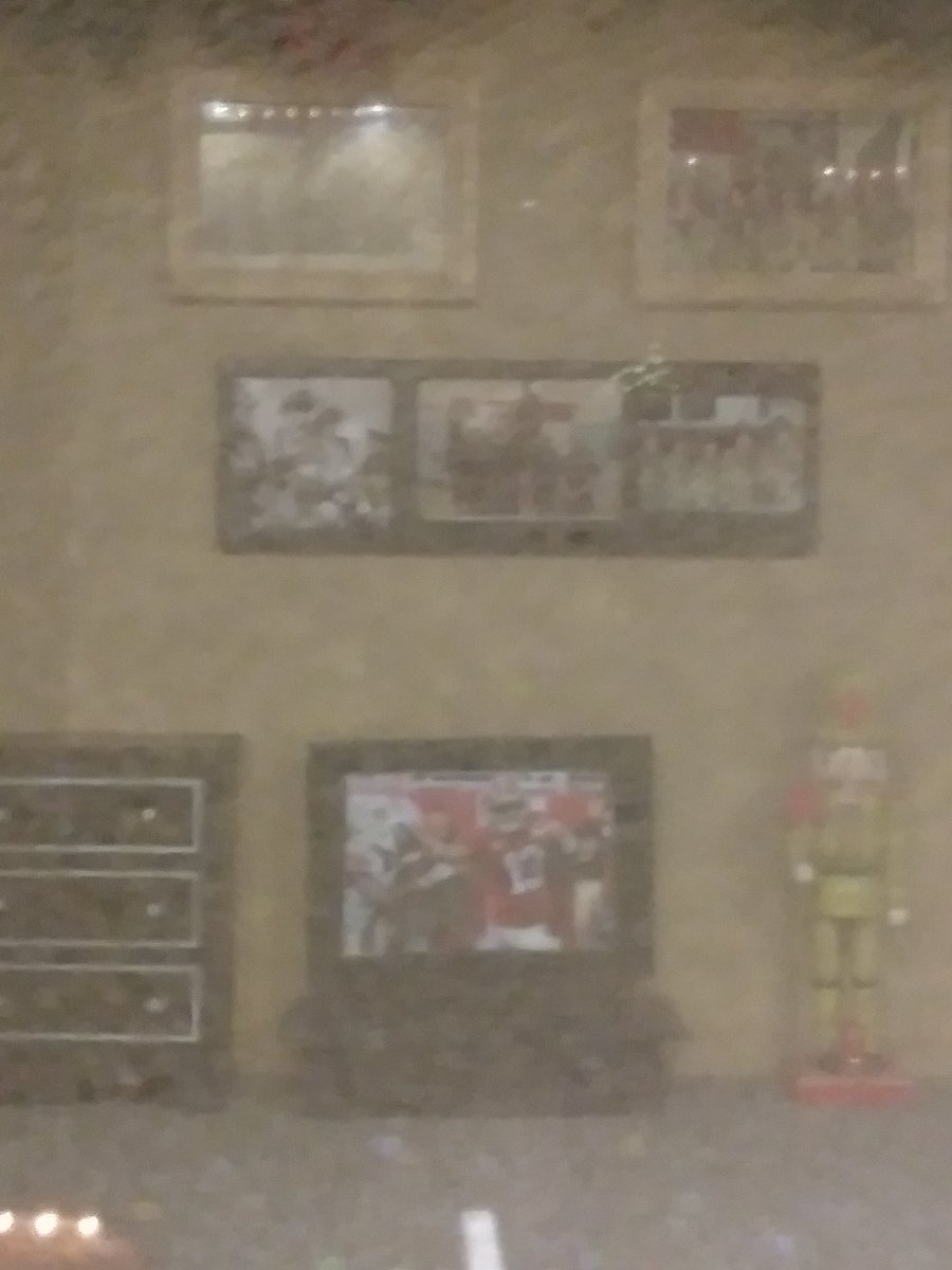 In a mini Christmas village at Foley, AL, I saw last night could not help but notice <a href="/Tuaamann/">Tua. T 🇦🇸</a> this picture in the miniature fire station lounge. So cute! Hard to see because of fog.