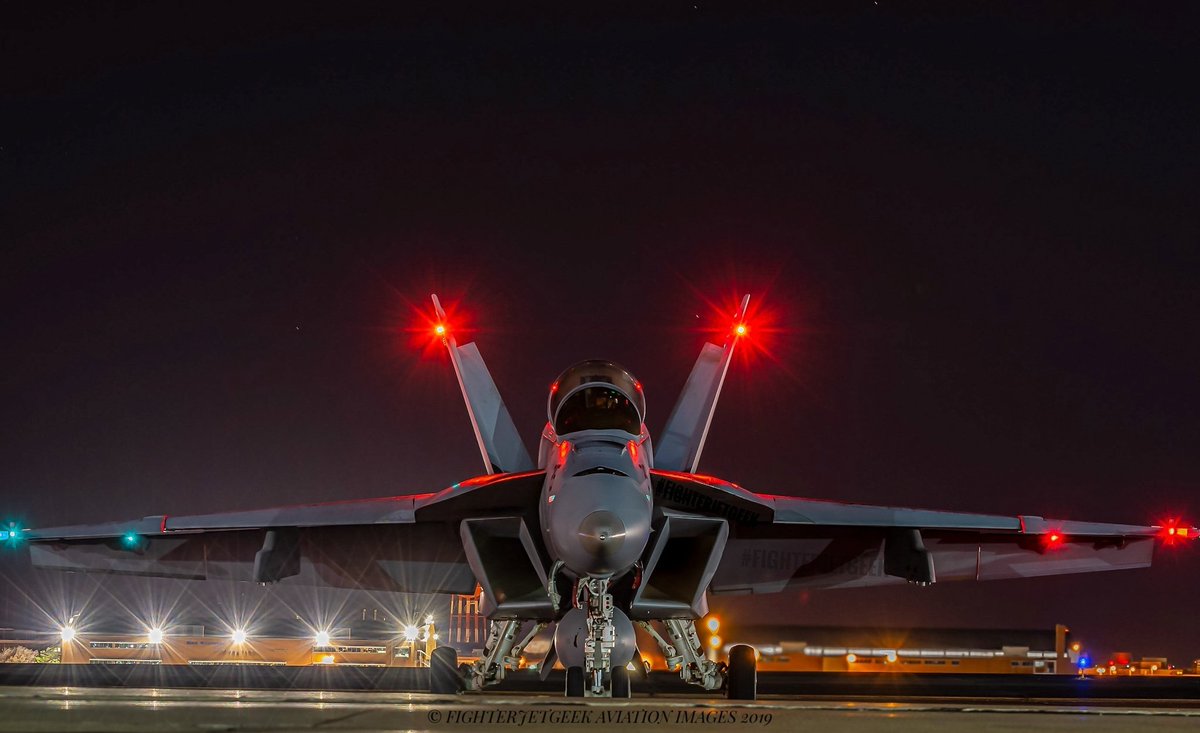fighterjetgeek's tweet photo. For my final post of 2019, and what I feel is my personal 'Top Shot' of the year..
'Gladiator In The Black'~
A F/A-18F #SuperHornet from the world famous #Gladiators of VFA-106, captured in a long exposure, shortly after the crew arrived out of the darkness.  #FighterJetGeek https://t.co/yJgnya3SWp